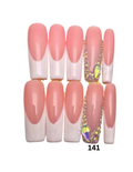 Ten false press-on nails. The nails have a glossy pink-to-white French tip design, with two nails decorated with gold rhinestone chains and iridescent gemstones.
