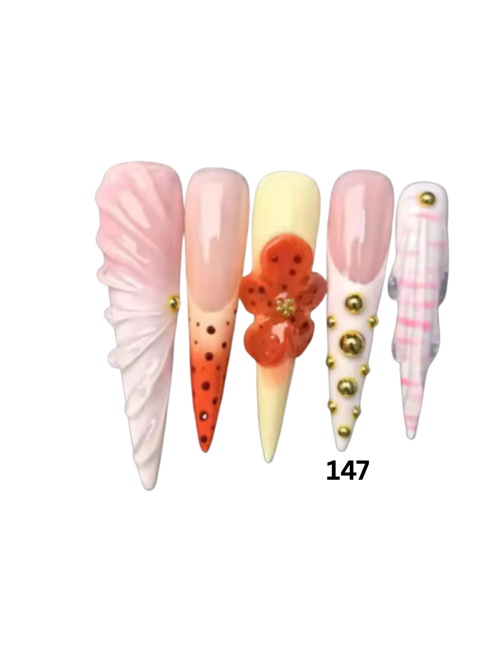 Decorative press-on nails feature pastel pink, cream, orange, and white designs with gold bead accents and a 3D floral detail.