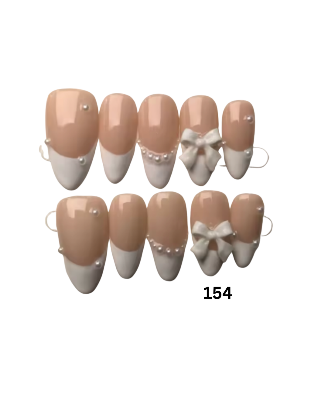 Press-on nails featuring a classic beige and white French tip design with some decorated nails adorned with small pearls and a bow. 