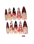 Set of 10 long stiletto press-on nails with a beige base, black and red striped tips, leopard print sections, and red embellishments.