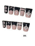 Set of 10 press-on nails with a black and pale pink French manicure design, decorated with rhinestones, bows, and a silver cross on one nail.